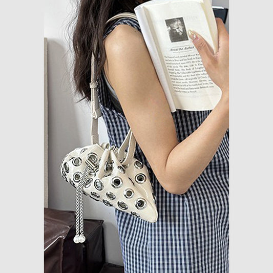 beige eyelet bag, beige strappy bag, eyelet bag, strappy bag