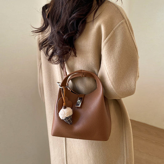 women's small crossbody bag, women's lightweight crossbody bag, women's small crossbody bag with detachable charm, tan crossbody bag