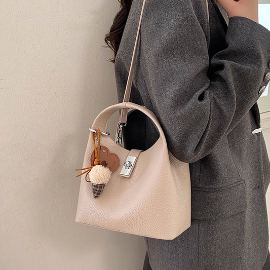 women's small crossbody bag, women's lightweight crossbody bag, women's small crossbody bag with detachable charm, taupe crossbody bag