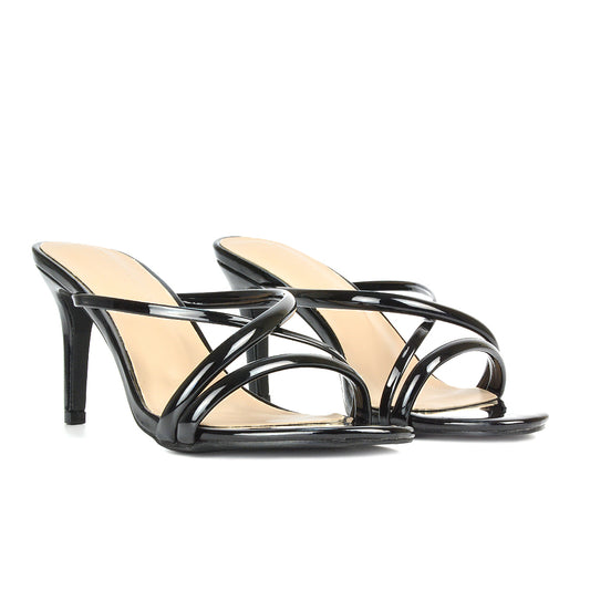black slip-on mid stiletto heel mule sandals with a pointed toe, designed for a chic and stylish look. Perfect for evening events, parties, or a night out, these trendy mules offer a blend of comfort and elegance for formal or casual occasions.