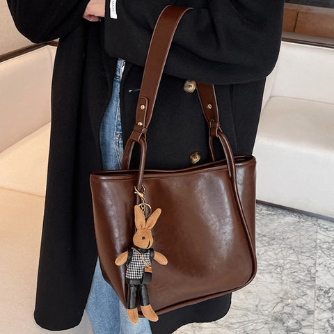 brown tote bag with bag charm, brown shoulder bag with bag charm, bag charms