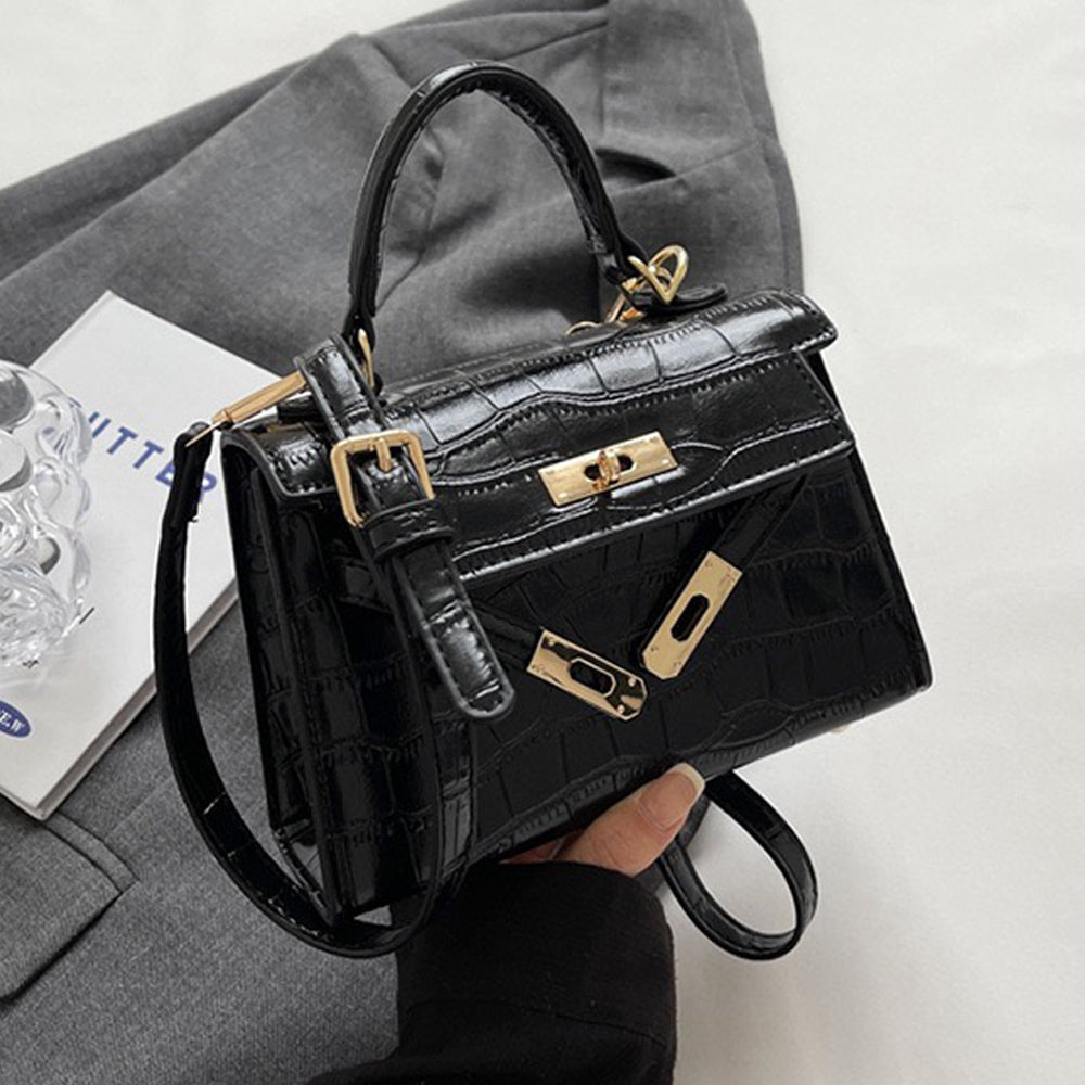 black buckle crossbody bag, black crossbody bag with an adjustable strap, buckle crossbody bag, crossbody bag with an adjustable strap