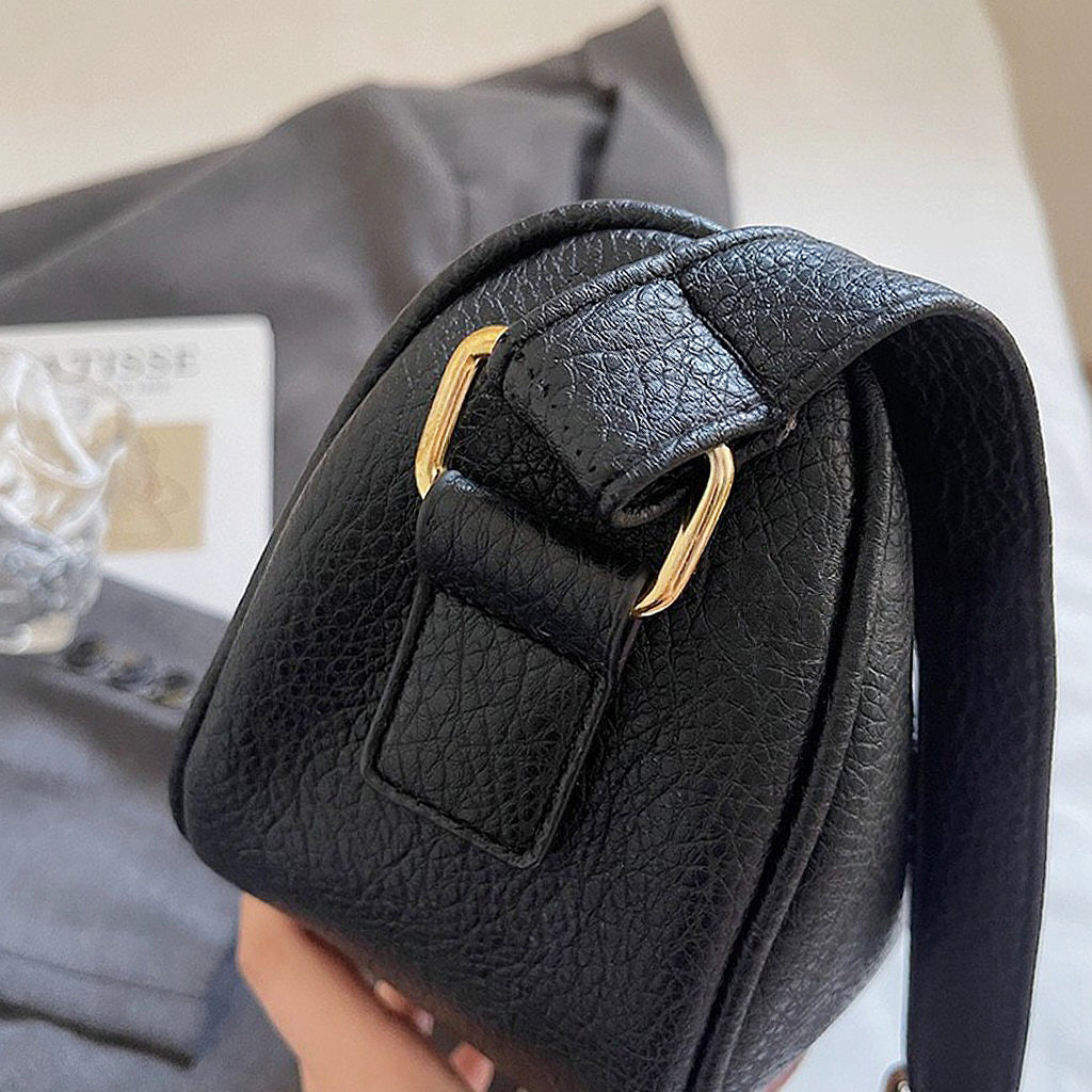 black handbag with shoulder strap
