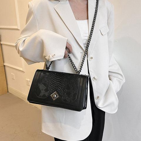 Black shoulder bag with snakeskin texture, Black faux leather bag with pattern, Elegant women’s handbag