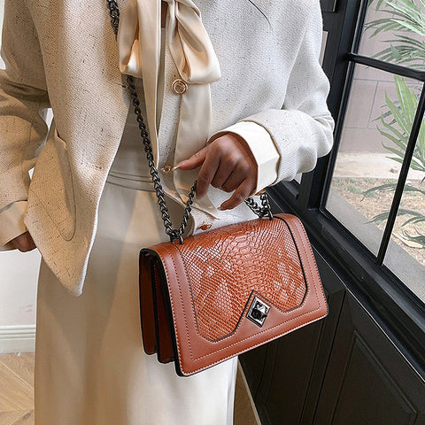 tan shoulder bag with snakeskin texture, tan faux leather bag with pattern, Elegant women’s handbag