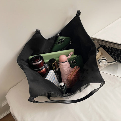 quilted shoulder tote bag, versatile women's tote bag, women's statement tote bag in wetlook, black handbag for work