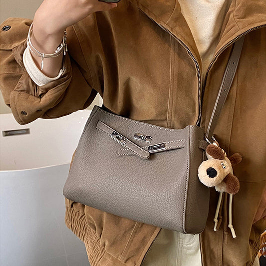 faux leather tote bag with charm, large faux leather tote bag, stylish faux leather tote bag with decorative charm, khaki shoulder bag, khaki shoulder tote bag