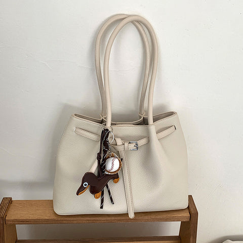 tote bag with charm, women's casual shoulder bag, stylish women's tote bag for everyday use, beige handbag with charm, womens beige handbag 