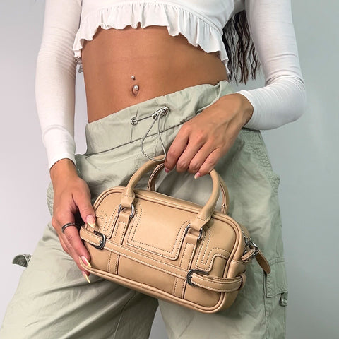 Small taupe handbag with top handle and shoulder strap
