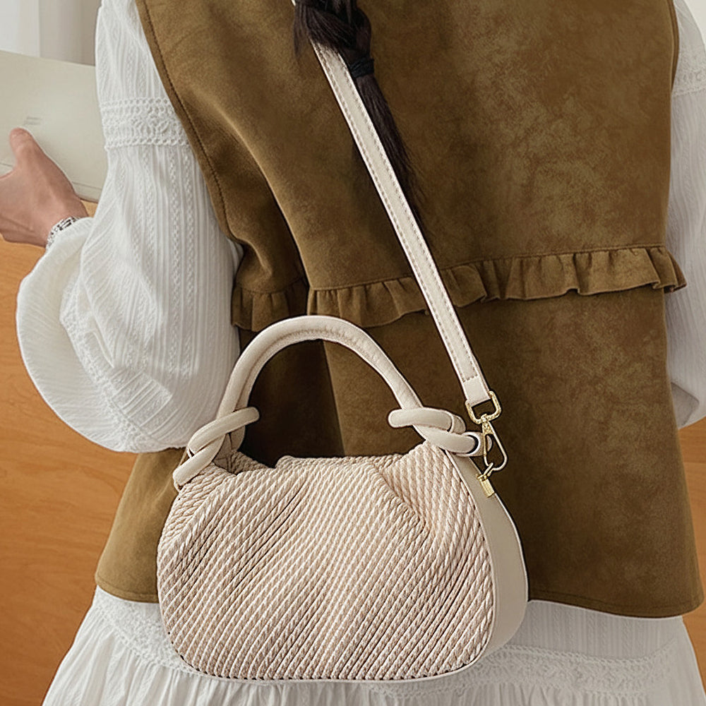 beige woven mini bag with top handle and crossbody strap for women