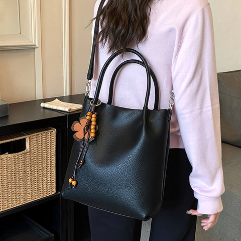 black floral charm bag, elegant black shoulder handbag for women