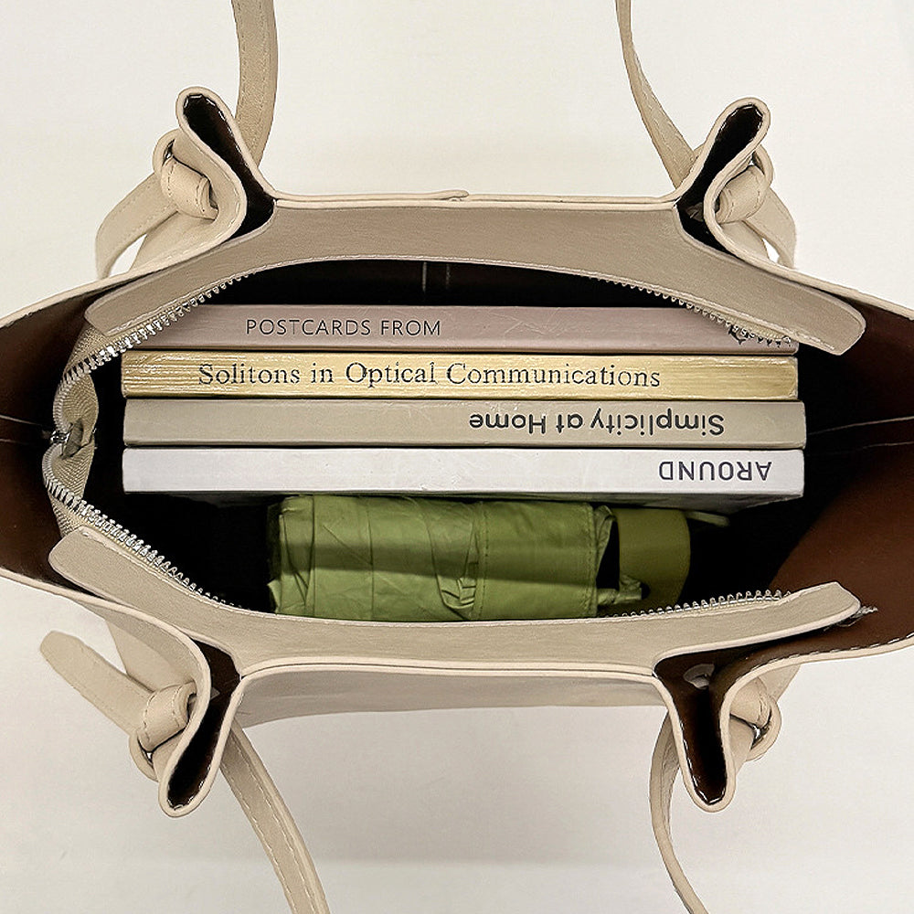 beige shoulder bag with adjustable crossbody strap