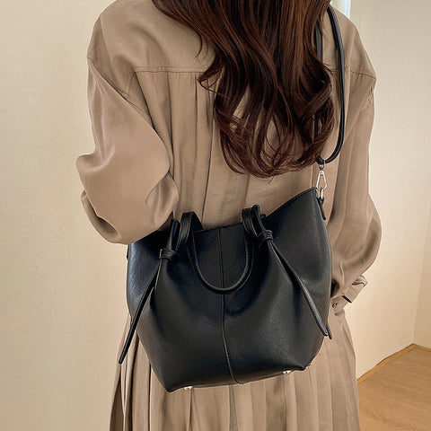 black shoulder tote handbag with crossbody strap