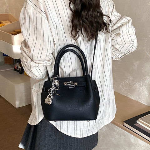black small handbag with crossbody strap