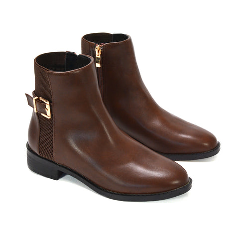 women’s brown leather ankle boots with gold zipper, sleek brown ankle boots for everyday wear, versatile women’s boots that pair with jeans and dresses, autumn boots, winter boots