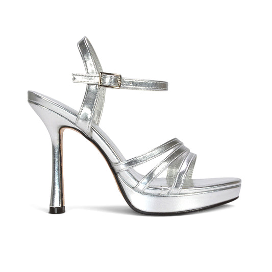 metallic silver platform heels for women, women’s silver stiletto platform sandals, silver strappy heels with tall platform sole, women’s shimmering silver high heel sandals