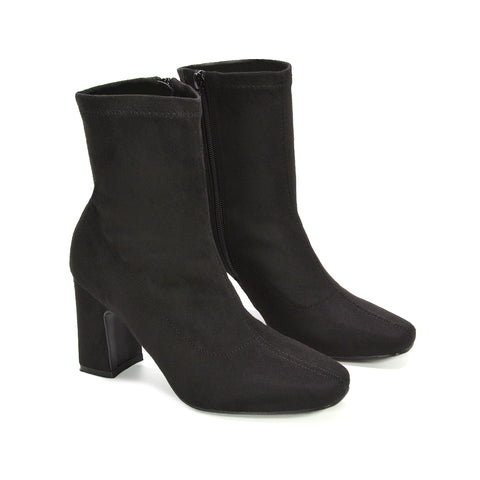 black heeled sock boots, black high heel boots, comfortable heeled boots, easy zip ankle boots, sleek ankle boots women, durable ankle boots, versatile ankle boots, transitional season boots, ankle boots side zip women