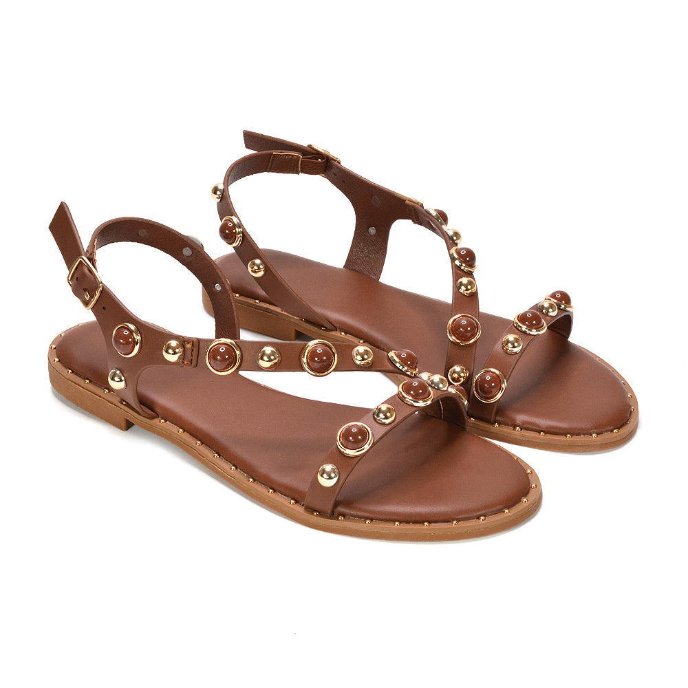 brown embellished flat sandals, brown open toe sandals with embellishments, brown open toe sandals with embellishments
