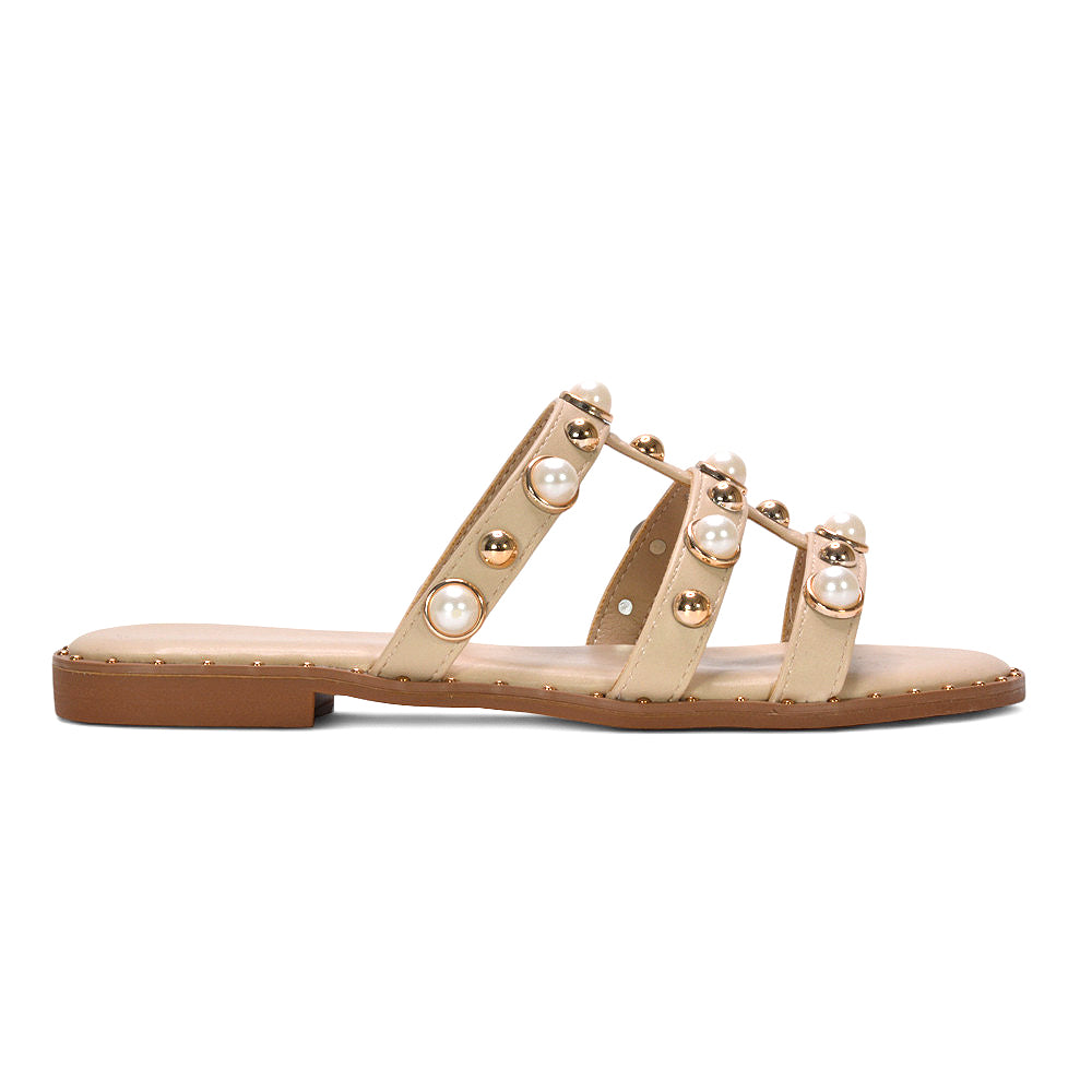 beige slip on flat studded strappy sandals for women, beige neutral strappy flat sandals with studs, beige flat sandals for summer holiday outfits women, best beige slip on flat strappy sandals for women