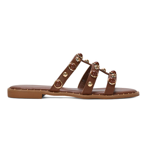 brown slip on flat studded strappy sandals for women, tan brown bohemian studded flat sandals women, brown flat sandals for summer holiday outfits women, cushioned brown flat slip on sandals for women, best brown slip on flat strappy sandals for women