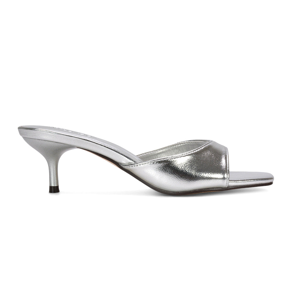 stiletto kitten heel sandals, elegant kitten heel slip-on sandals, fashion-forward kitten heel sandals, dressy mule sandals for evening wear, cushioned insole mule heels, best square toe mule heels for women, silver stiletto heels, silver square toe heels