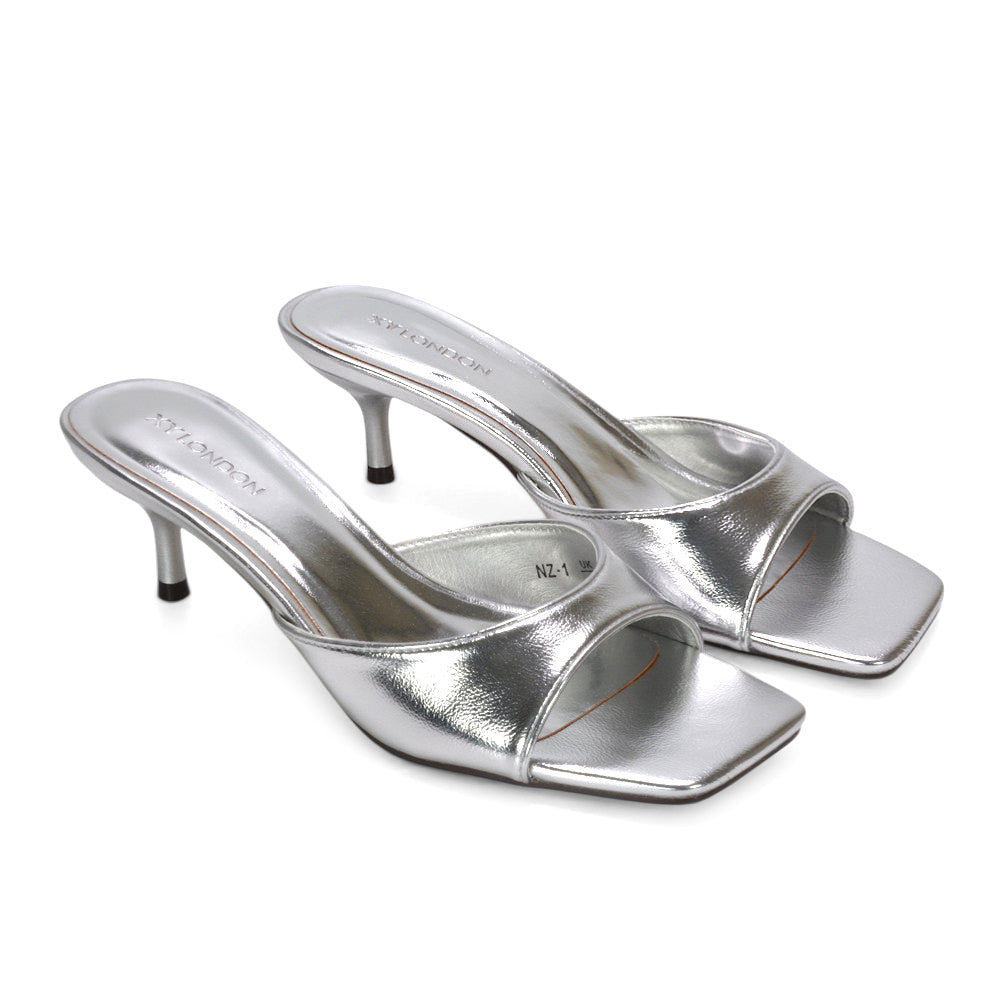 slip-on heeled sandals, chic open toe kitten heel mules, sleek slip-on stiletto mules, silver slip on stiletto heels, silver mid heel mules
