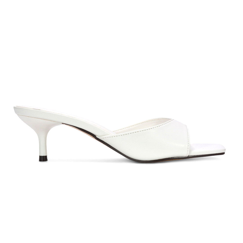 summer heels, kitten heel mule sandals, minimalist square toe stiletto mule heels, mule heels, kitten heel sandals for parties, faux leather kitten heel mules, affordable kitten heel mule sandals, white mule heels, white summer heels