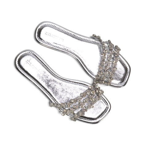 Party-ready silver flats, Women's metallic silver strappy flat sandals, Women's silver slide sandals, Women's silver party sandals with diamante detailing