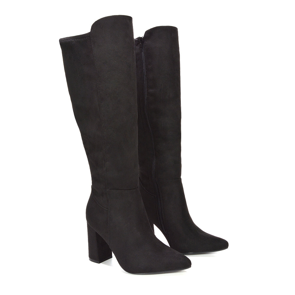 black boots for fall-to-winter transition, deep black winter fashion boots, dressy black long boots for formal looks, comfortable black knee boots with heel, timeless knee-high boot trend, fashionable tall boots for layering, elegant tall boots for special occasions, stylish knee high boots for fall and winter fashion,  winter dress boots for women