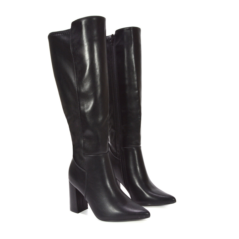 black boots for fall-to-winter transition, deep black winter fashion boots, dressy black long boots for formal looks, comfortable black knee boots with heel, timeless knee-high boot trend, fashionable tall boots for layering, elegant tall boots for special occasions, stylish knee high boots for fall and winter fashion,  winter dress boots for women